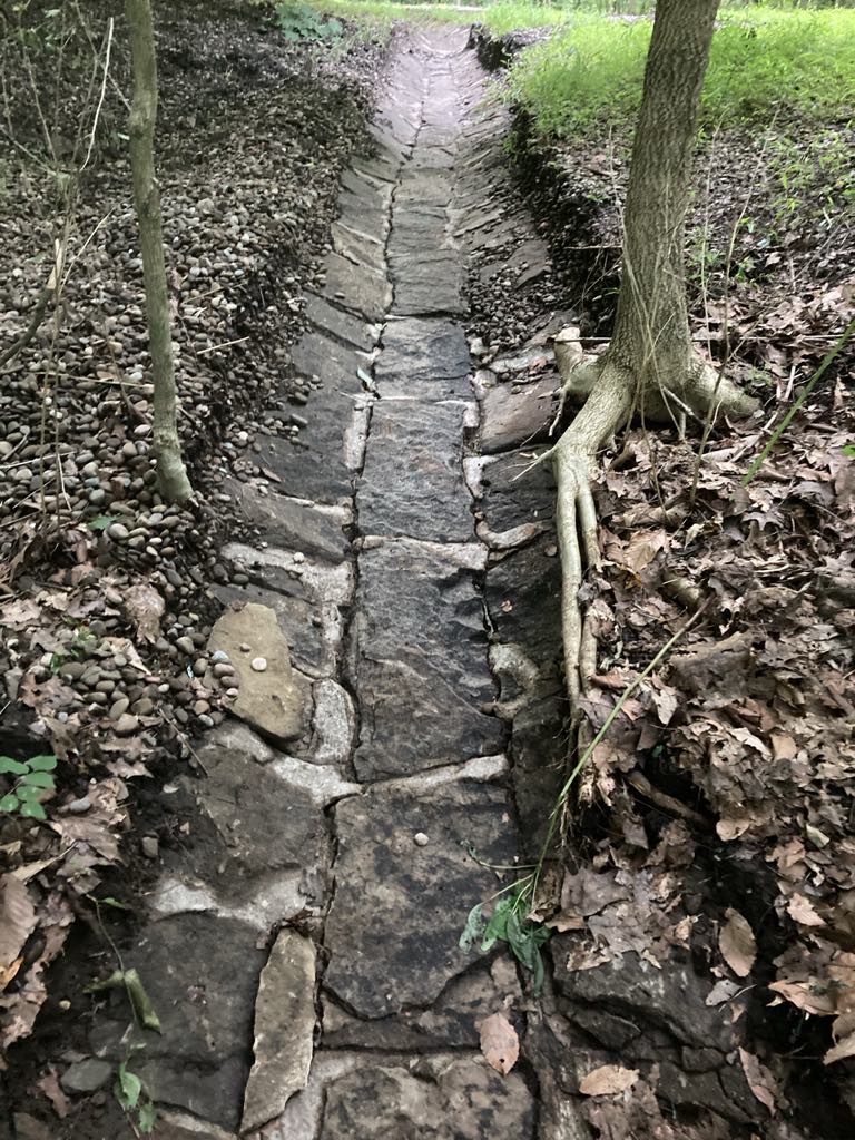 Stone-lined drainage channel